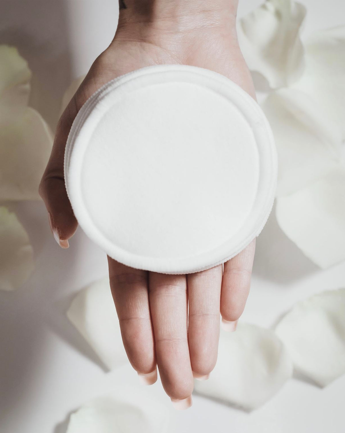 12 tampons démaquillants avec sac