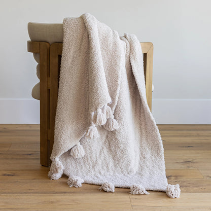 Jeté étendu à imprimé double épaisseur uni beige rougissant avec pompons