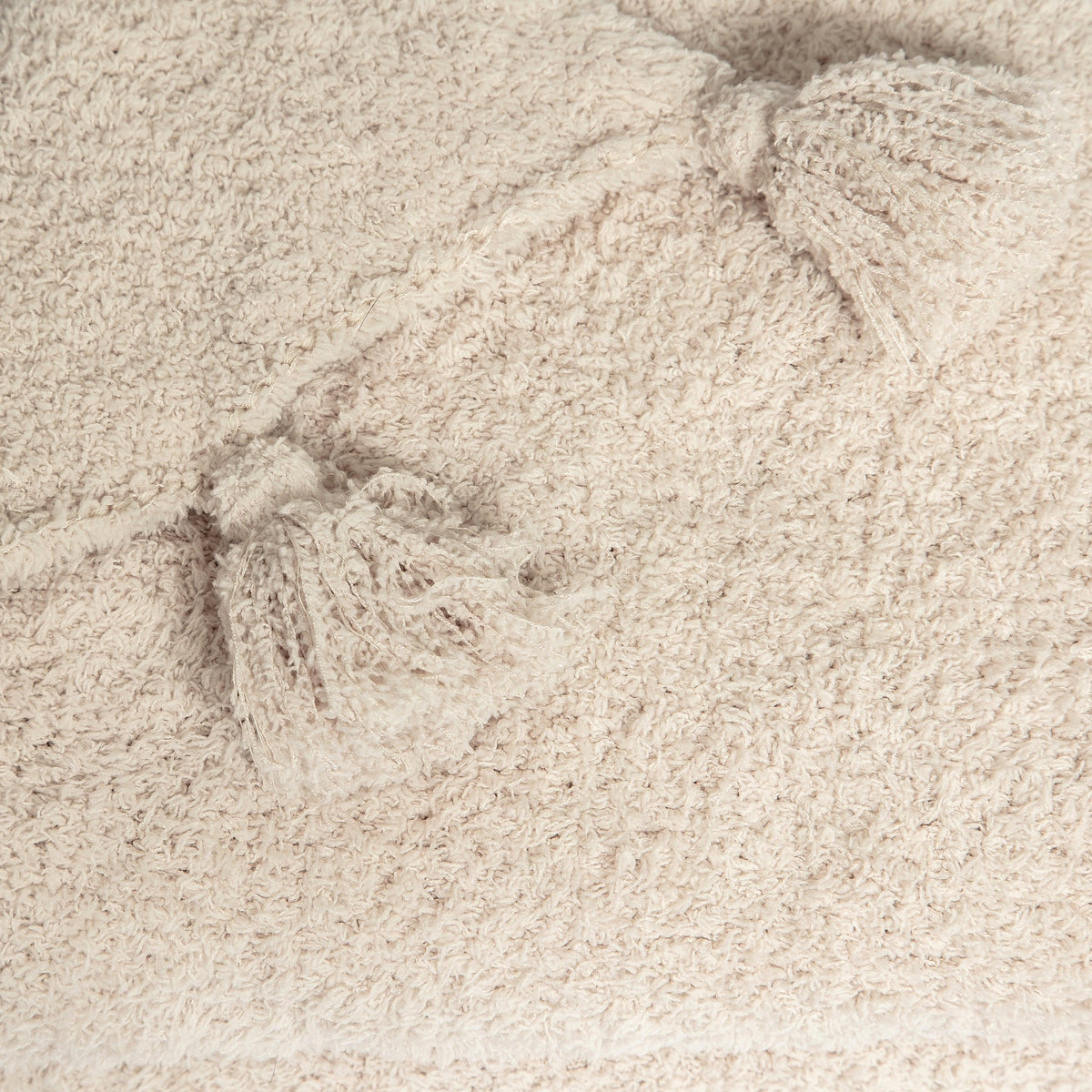 Jeté étendu à imprimé double épaisseur uni beige rougissant avec pompons