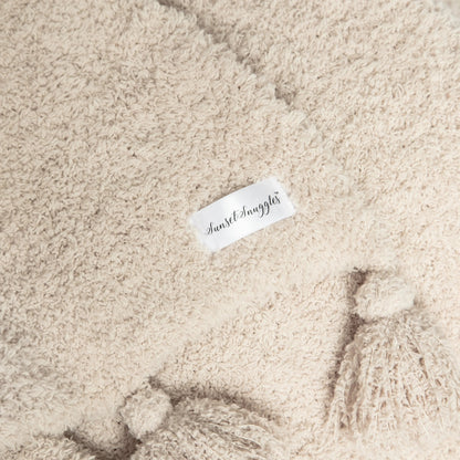 Jeté étendu à imprimé double épaisseur uni beige rougissant avec pompons
