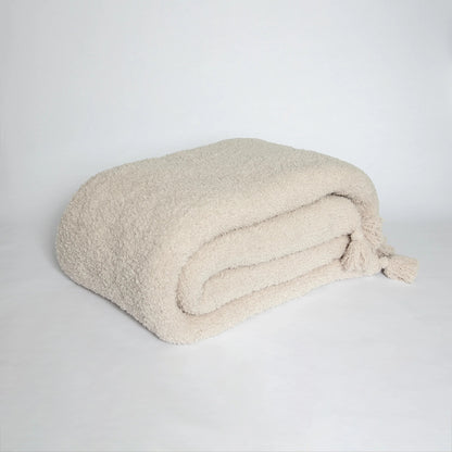 Jeté étendu à imprimé double épaisseur uni beige rougissant avec pompons