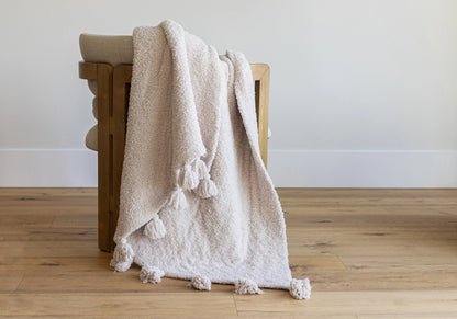 Jeté étendu à imprimé double épaisseur uni beige rougissant avec pompons