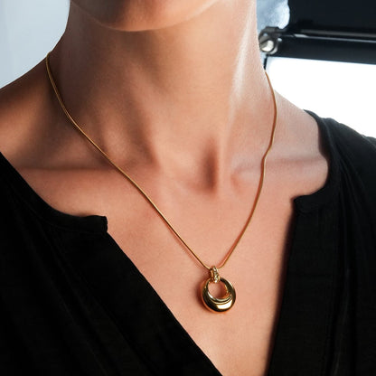 ALBASIMI: Snake Skin Chain with Zirconia (CZ) Embedded Clasp & Asymmetrical Circle Pendent.