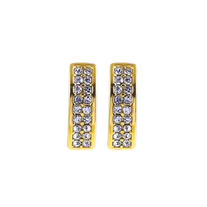 ASTRID : Boucles d'oreilles clous minimalistes en or avec barre incurvée pavée de zircone