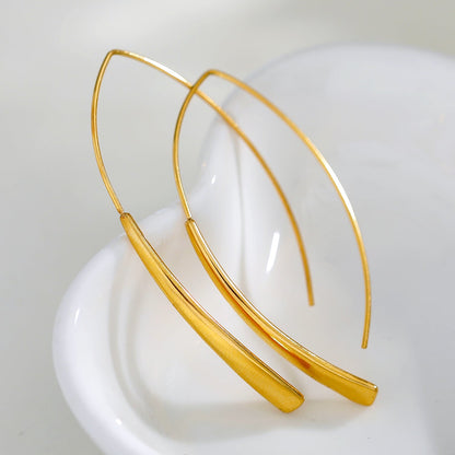 XIMENA: Boucles d'oreilles créoles dorées à courbes géométriques
