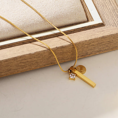 Style DEFNIE: Snake-Skin textured Dainty Chain Necklace Anchoring a Trio of Charms