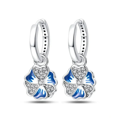 Boucles d'oreilles créoles en argent sterling avec breloque fleur bleue élégante